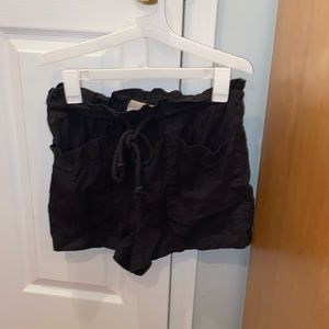 Woman’s dark gray elastic shorts size medium. In excellent condition.